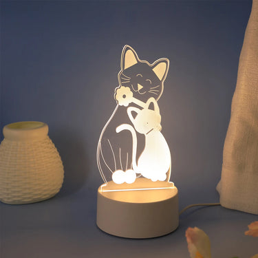 KittyNook Cat Co. 3D Cat Night Light: color-changing, two hugging cats on a round base next to a textured jar.